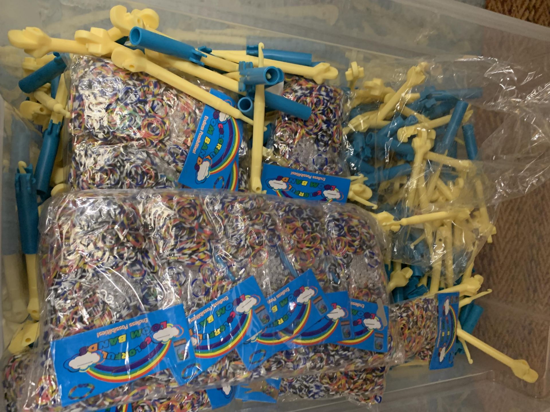 A BOX OF LOOM BANDS AND ACCESSORIES