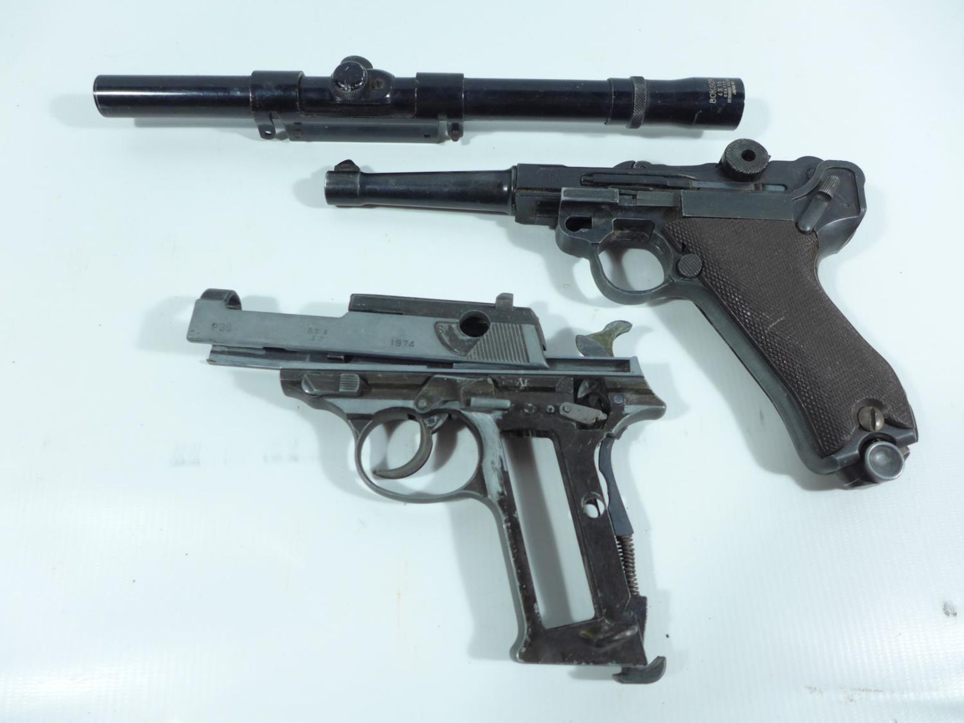 A REPLICA 9MM NON-FIRING LUGER AND PART OF A P38 (A/F) AND A BOKSON 4X15 TELESCOPIC SIGHT (3)