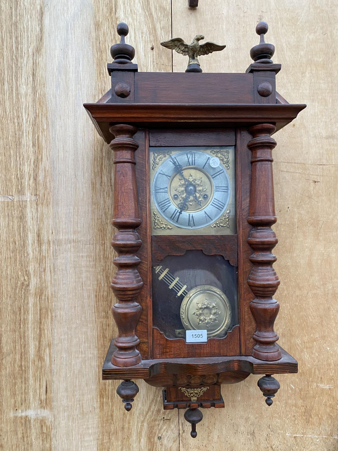 A VINTAGE VIENNA STYLE WALL CLOCK WITH BRASS EAGLE TOPPER