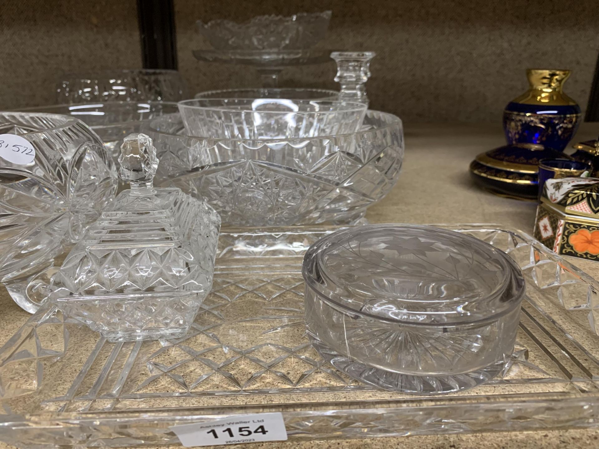 A LARGE QUANTITY OF GLASSWARE TO INCLUDE CUT GLASS BOWLS, CANDLESTICKS, A CAKE STAND, PART - Image 2 of 4