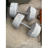 A PAIR OF CONCERETE DUMB BELL WEIGHTS