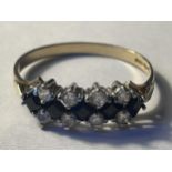 A 9 CARAT GOLD RING WITH FIVE SAPPHIRES AND TEN CUBIC ZIRCONIAS GROSS WEIGHT 1.77 GRAMS SIZE R/S