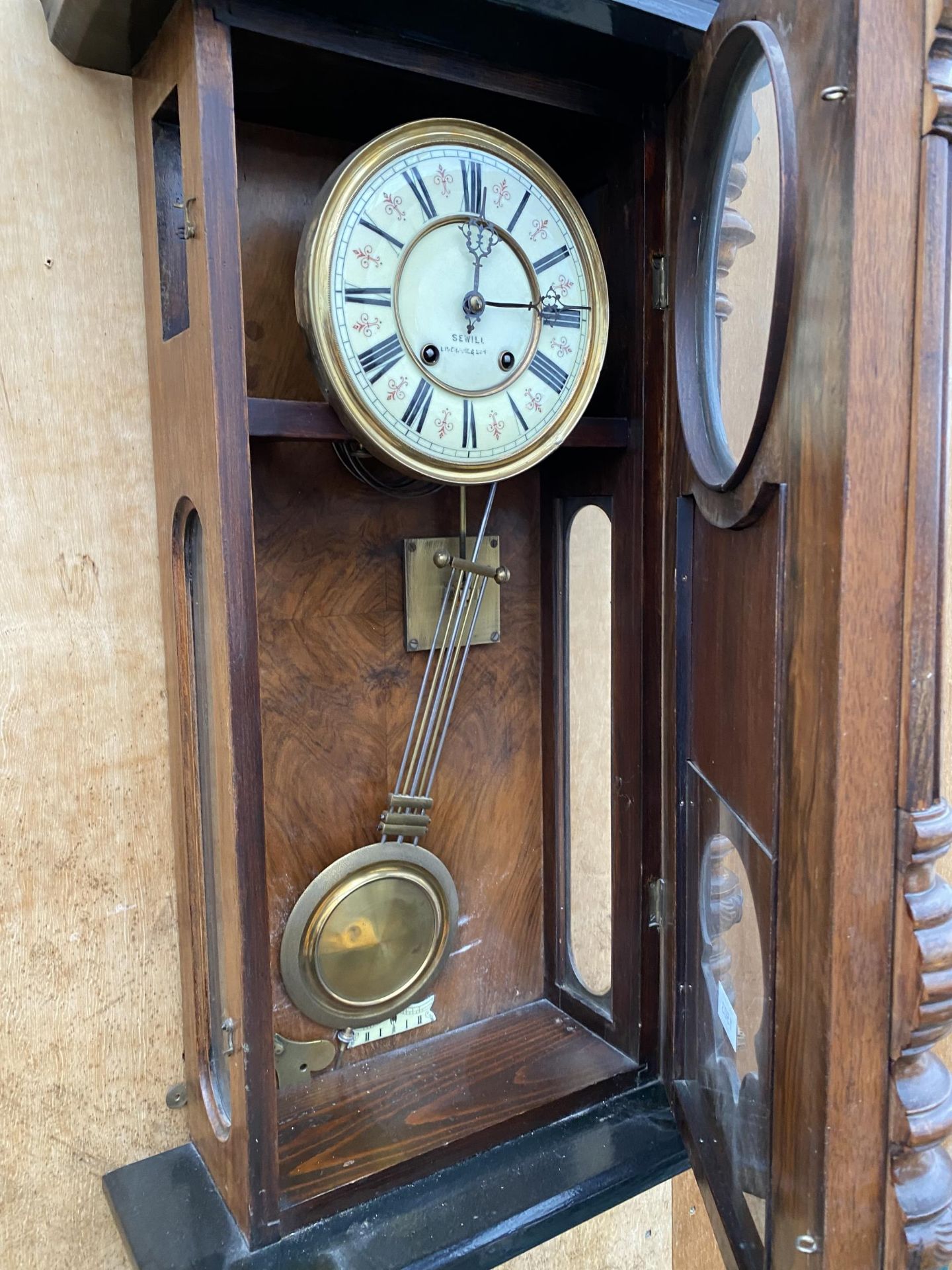 A LARGE WOODEN WALL CLOCK BEARING THE NAME 'SEWILL' - Image 4 of 4