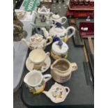 A MIXED LOT OF CERAMIC TEAPOTS TO INCLUDE FRUIT DESIGN EXAMPLES