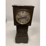 A VINTAGE CARVED OAK EIGHT DAY SMALL MANTLE CLOCK