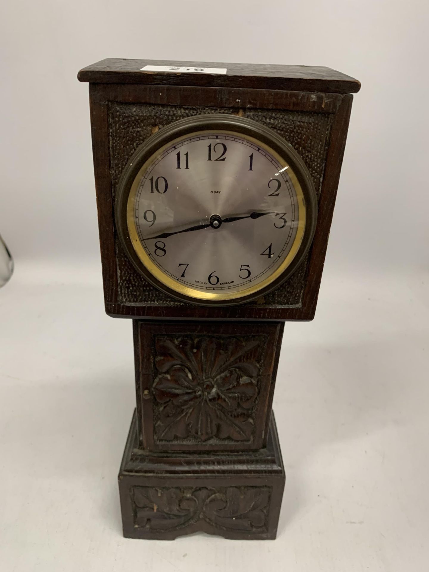 A VINTAGE CARVED OAK EIGHT DAY SMALL MANTLE CLOCK