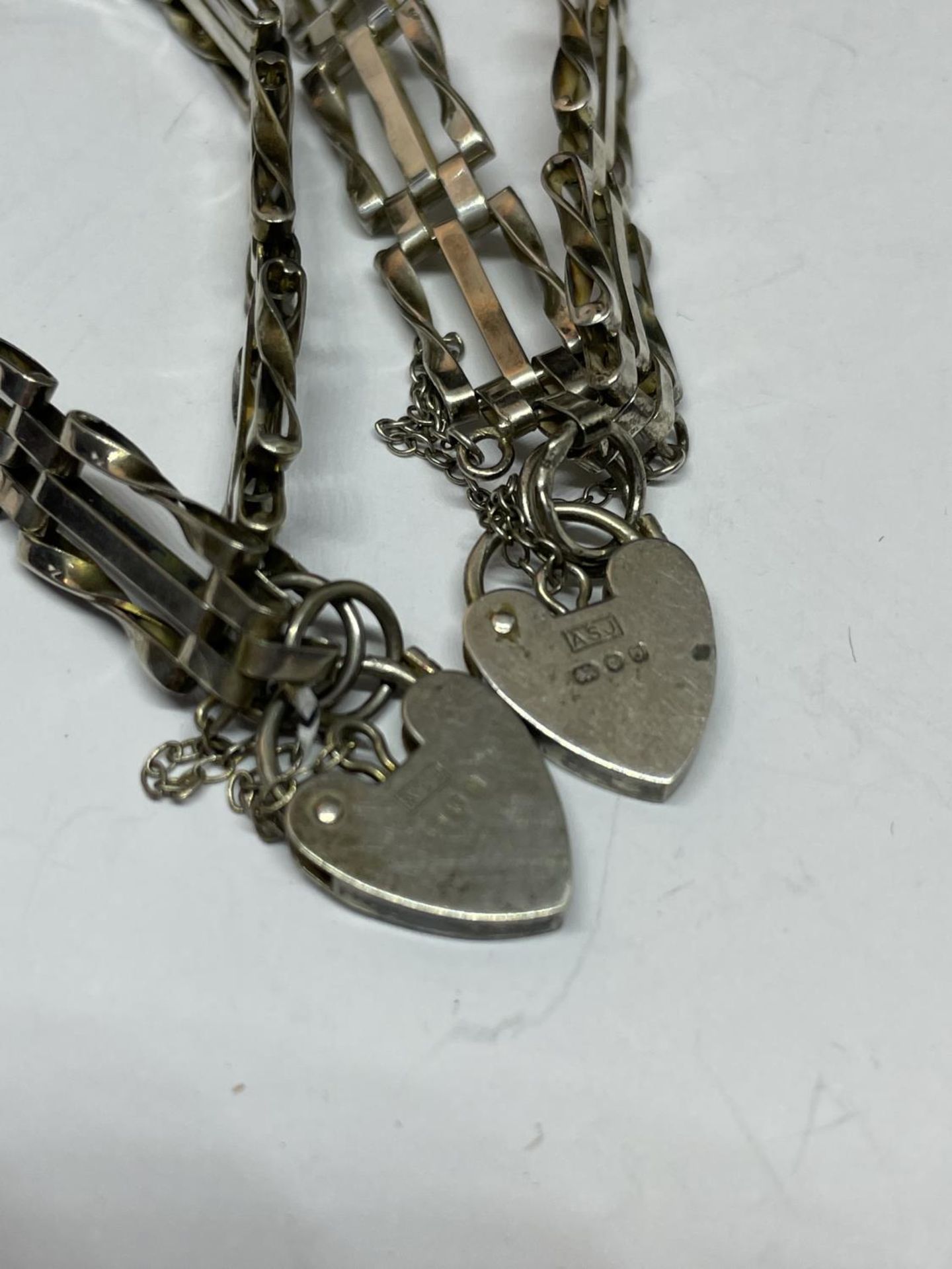 TWO SILVER THREE BAR GATE BRACELETS WITH HEART PADLOCKS - Image 2 of 2