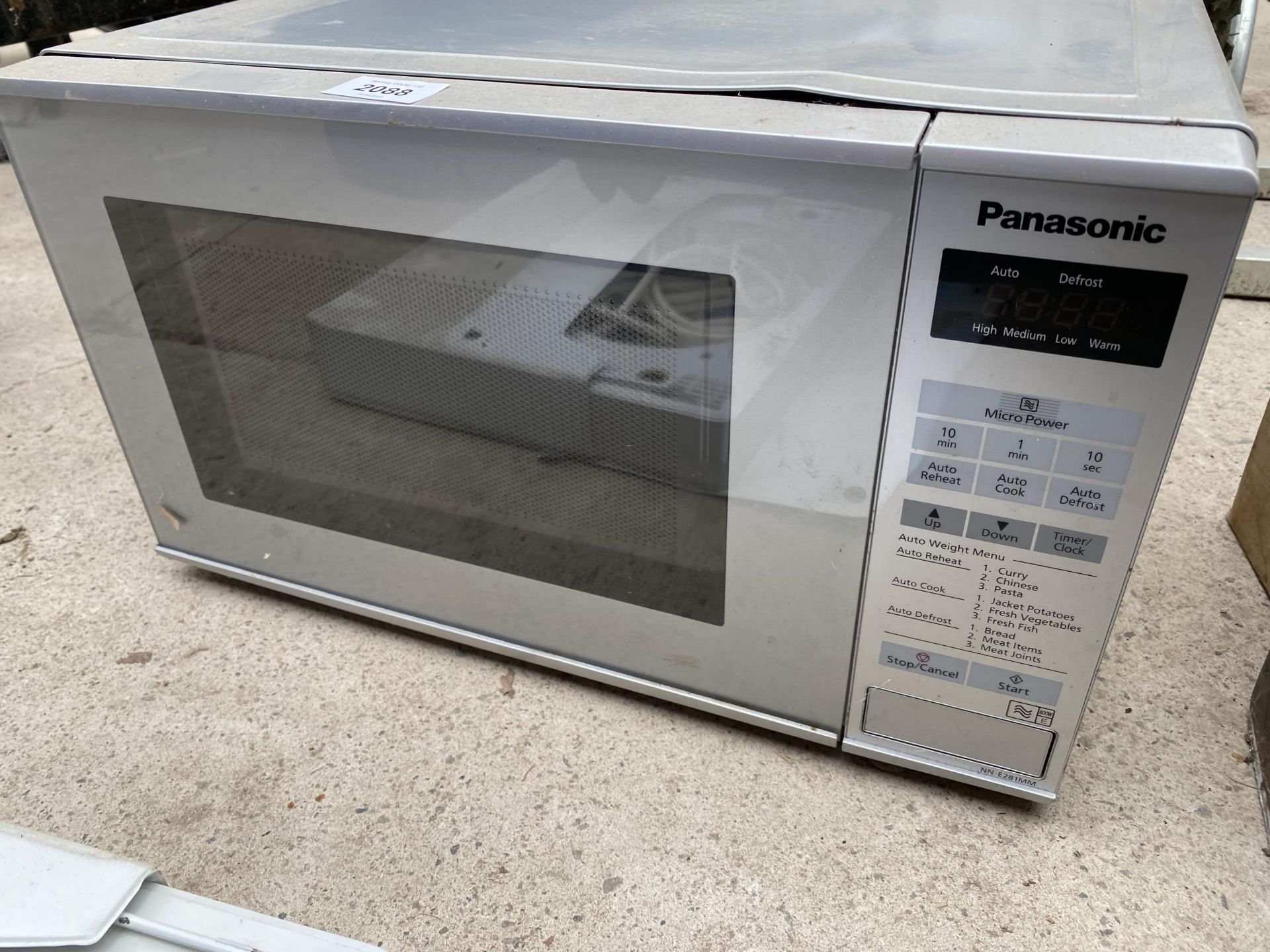 A SILVER PANASONIC MICROWAVE OVEN - Image 2 of 2