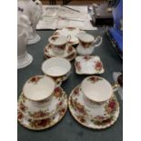 A ROYAL ALBERT 'OLD COUNTRY ROSES' PART TEA SET TO INCLUDE CUPS, SAUCERS, PLATES, A CREAM JUG, SUGAR