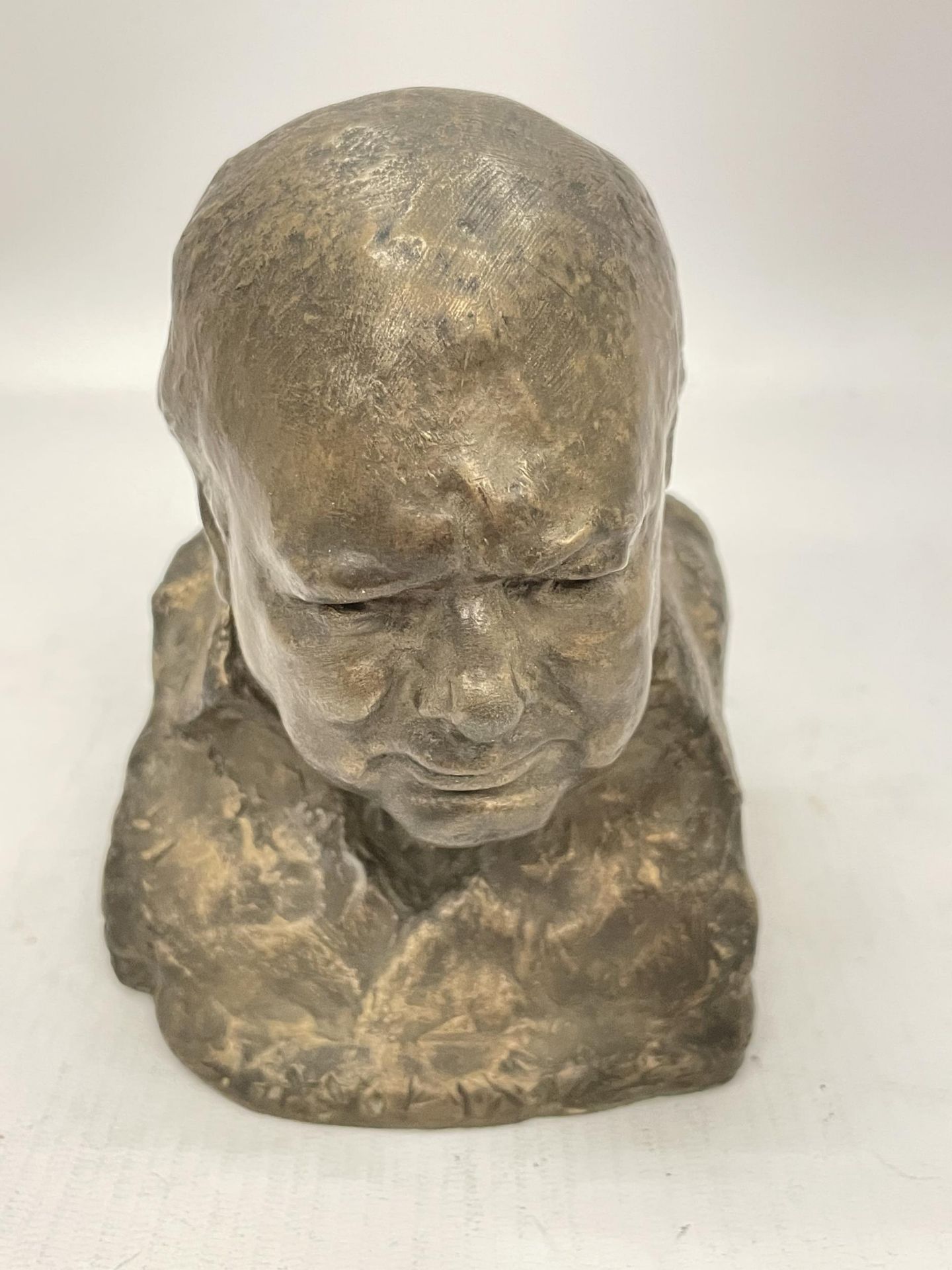 A BRONZED BUST OF WINSTON CHURCHILL