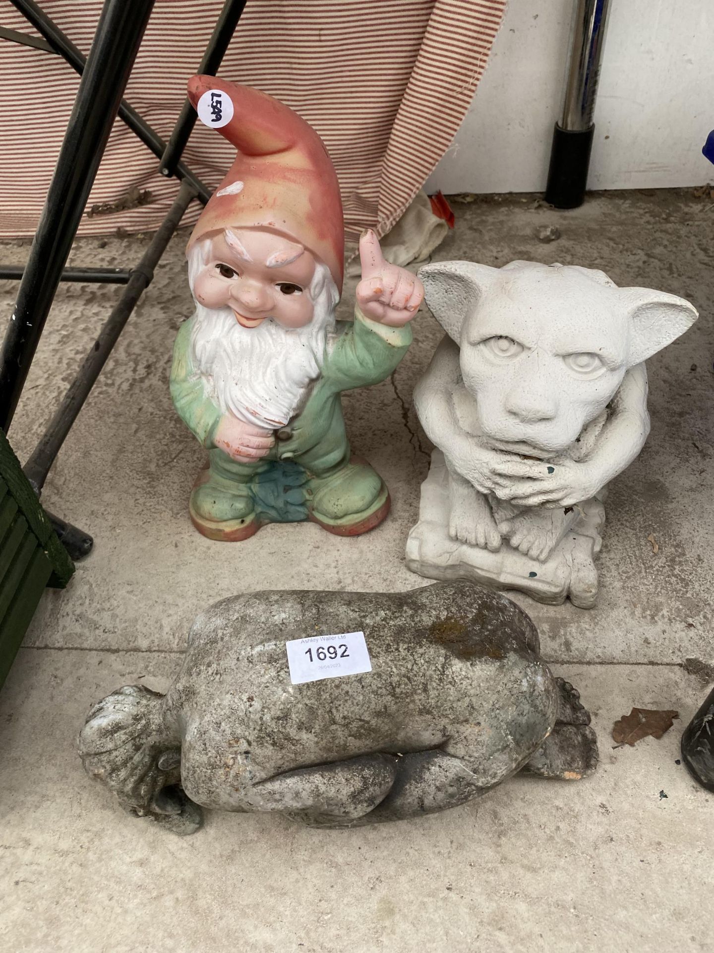 THREE GARDEN FIGURES TO INCLUDE A GNOME ETC