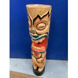 A LARGE WOODEN TIKI STATUE