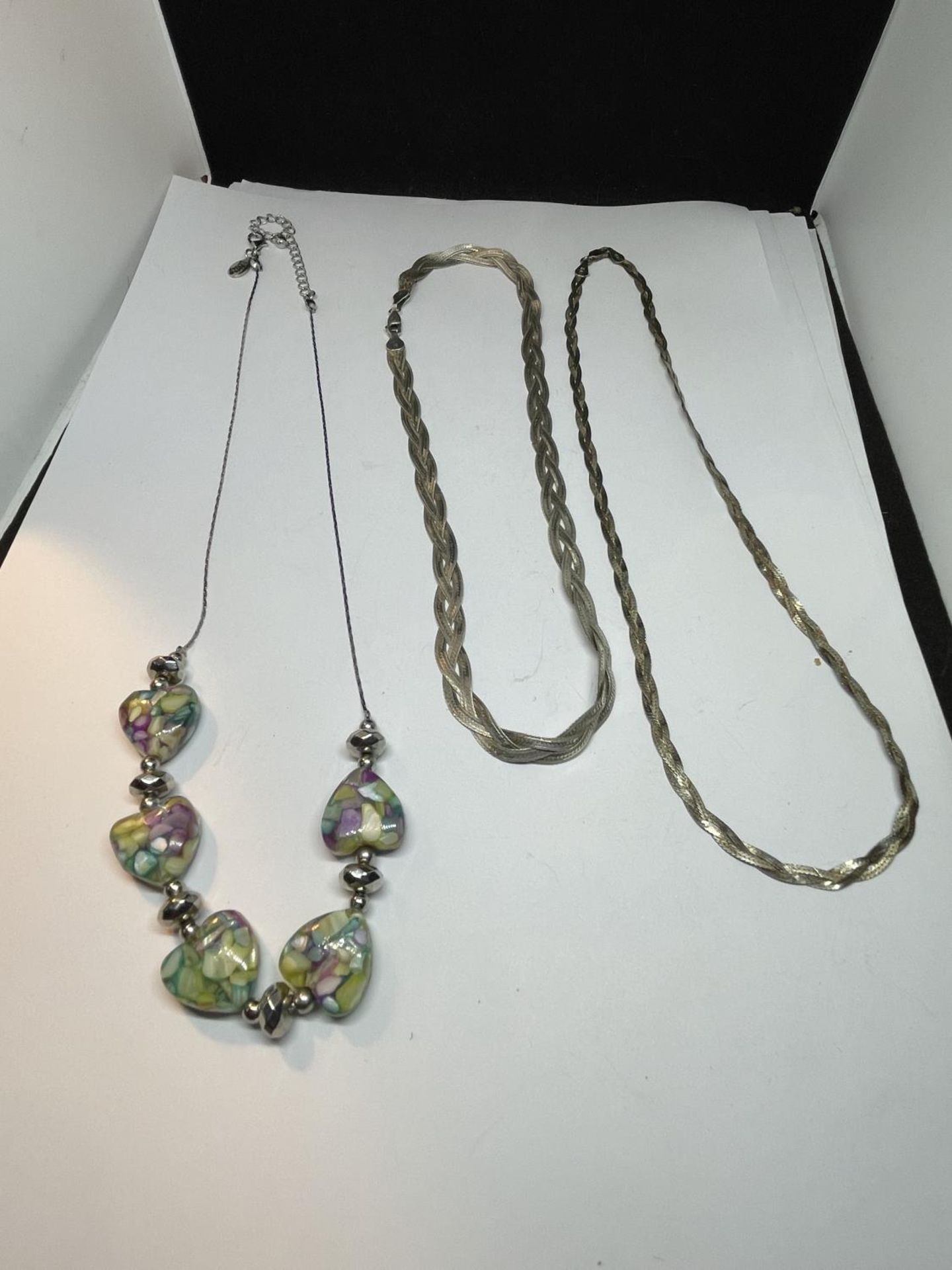 THREE SILVER NECKLACES TWO TWISTD AND ONE WITH MURANO STYLE HEARTS