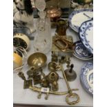 A LARGE QUANTITY OF COPPER AND BRASS ITEMS TO INCLUDE A KETTLE, CANDLESTICKS, A BELL, SMALL BUGLE,