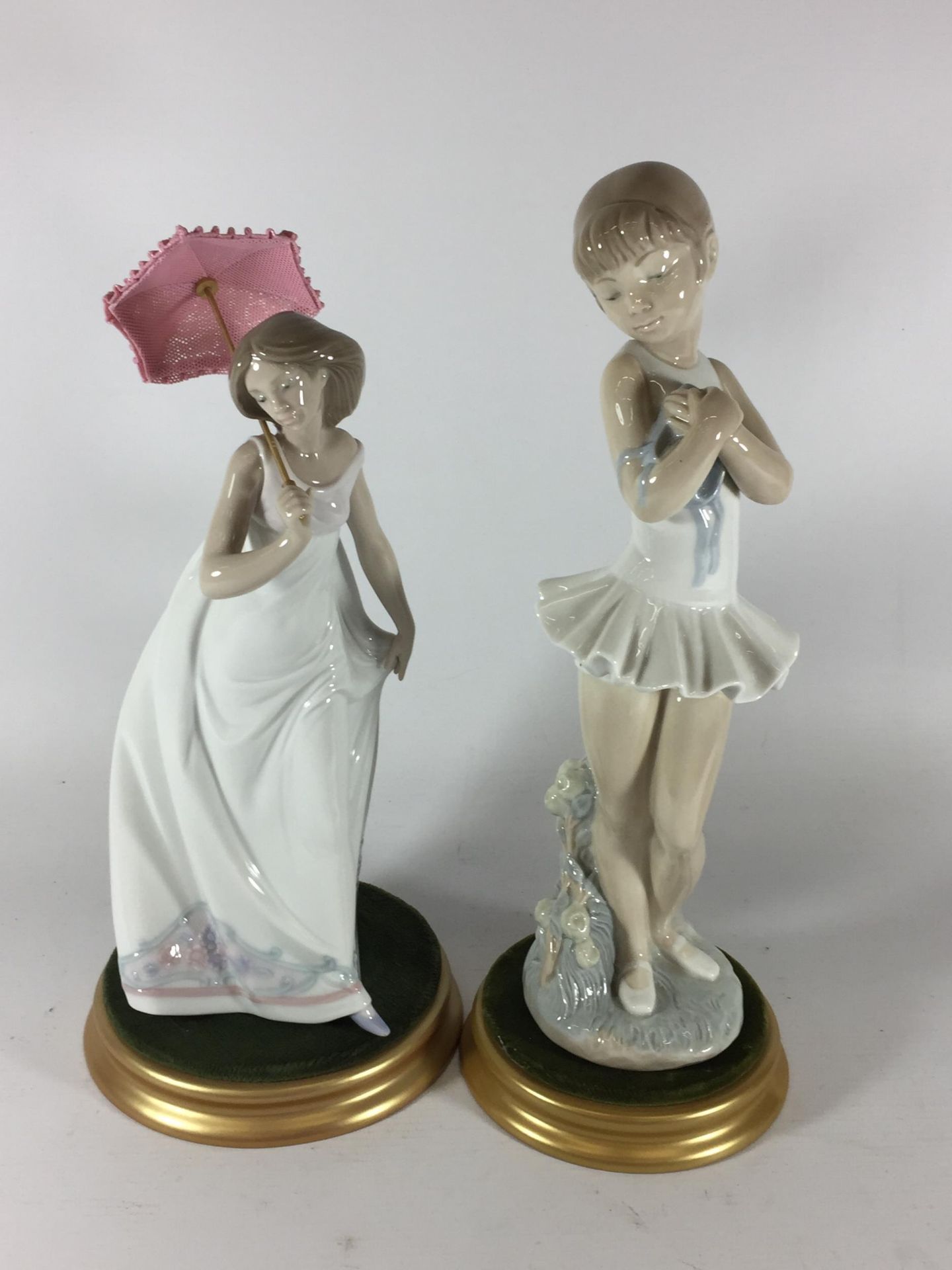 TWO LLADRO GIRL FIGURES TO INCLUDE PARASOL EXAMPLE, BOTH ON DISPLAY BASES