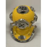 A SMALL YELLOW METAL DIVERS HELMET, HEIGHT 19CM