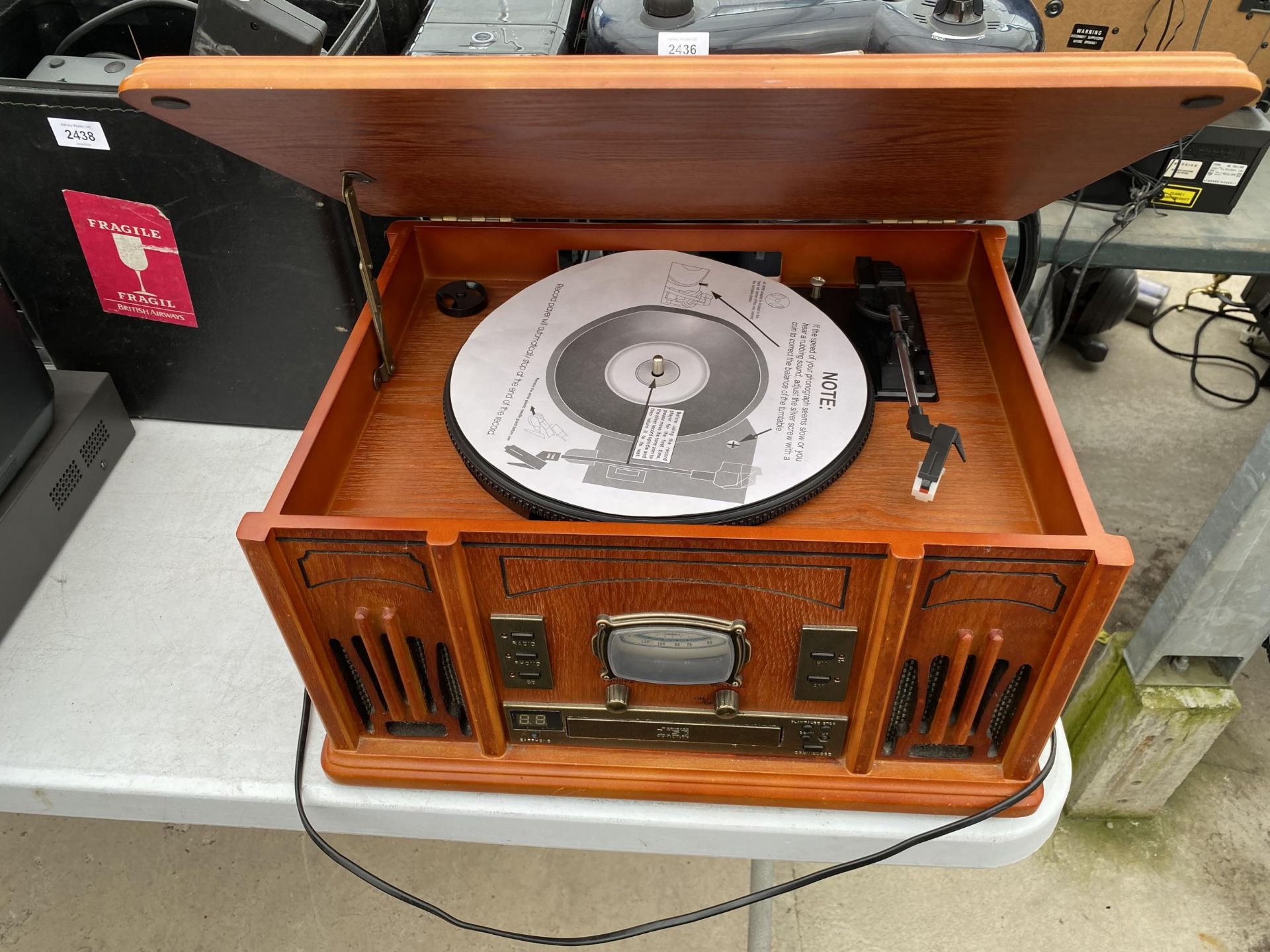 A RETRO STYLE TURNTABLE AND CD PLAYER