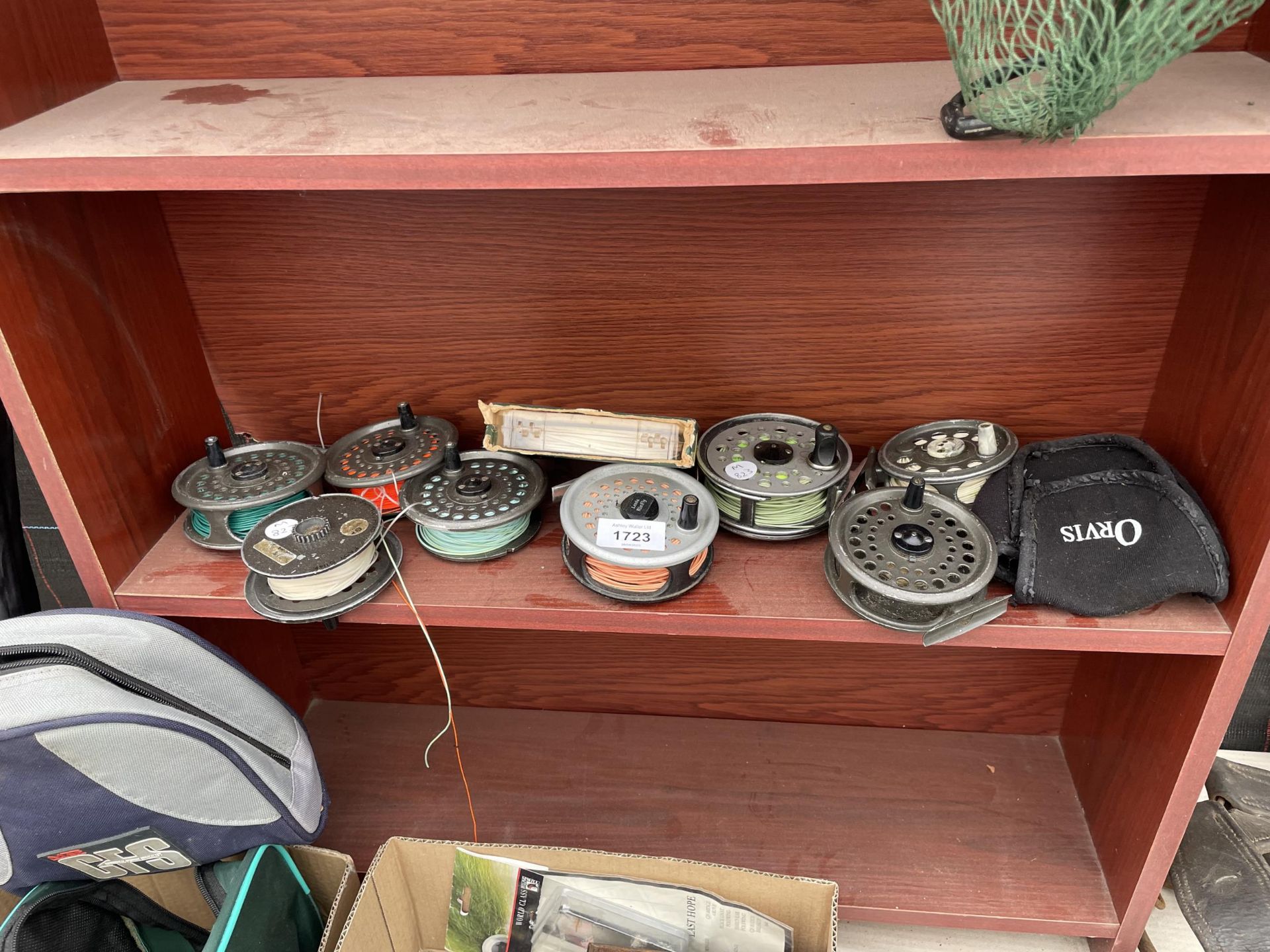 EIGHT VARIOUS FLY FISHING REELS AND A SPOOL OF FLY LINE