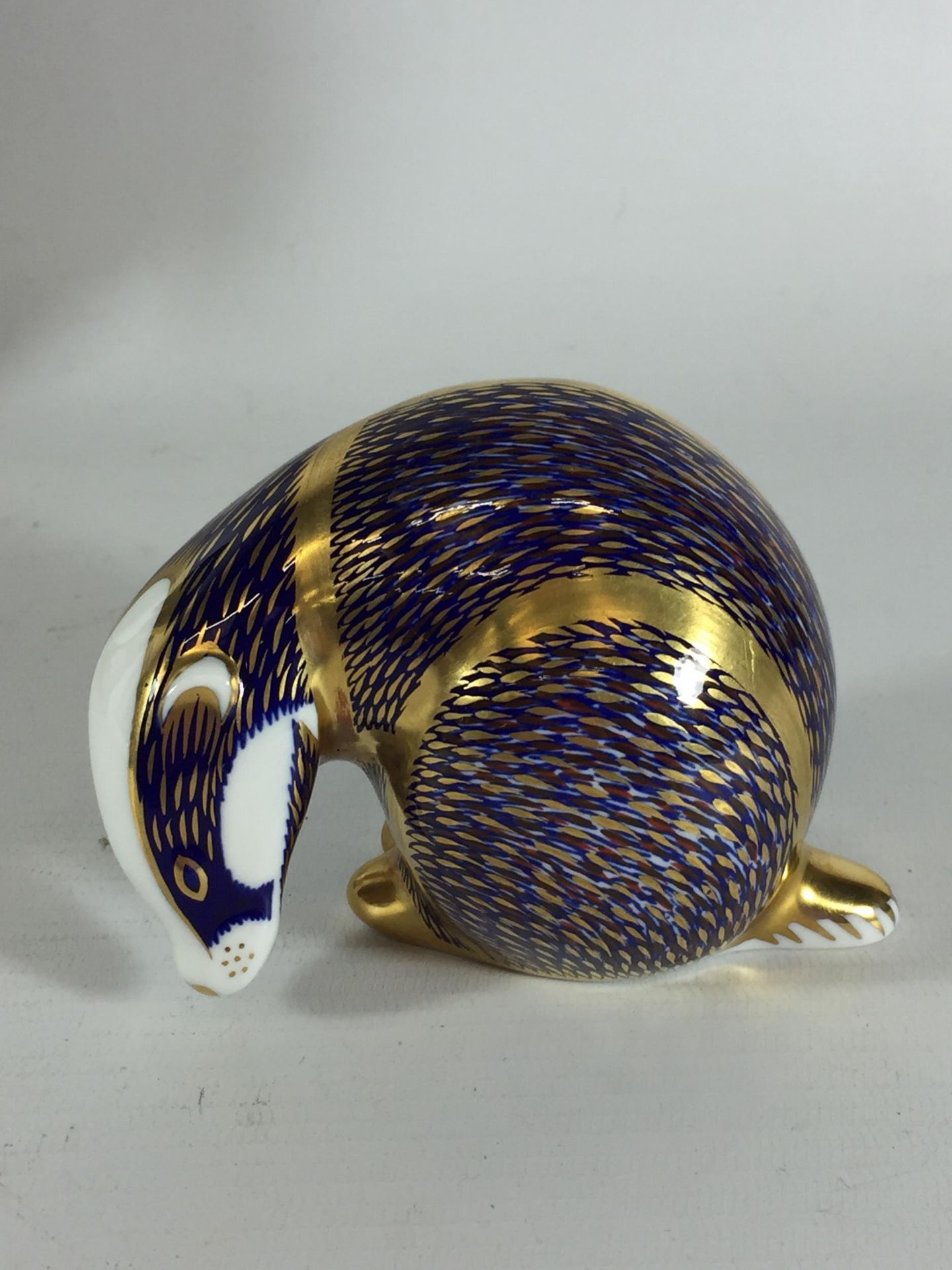 A ROYAL CROWN DERBY BADGER PAPERWEIGHT, GOLD STOPPER