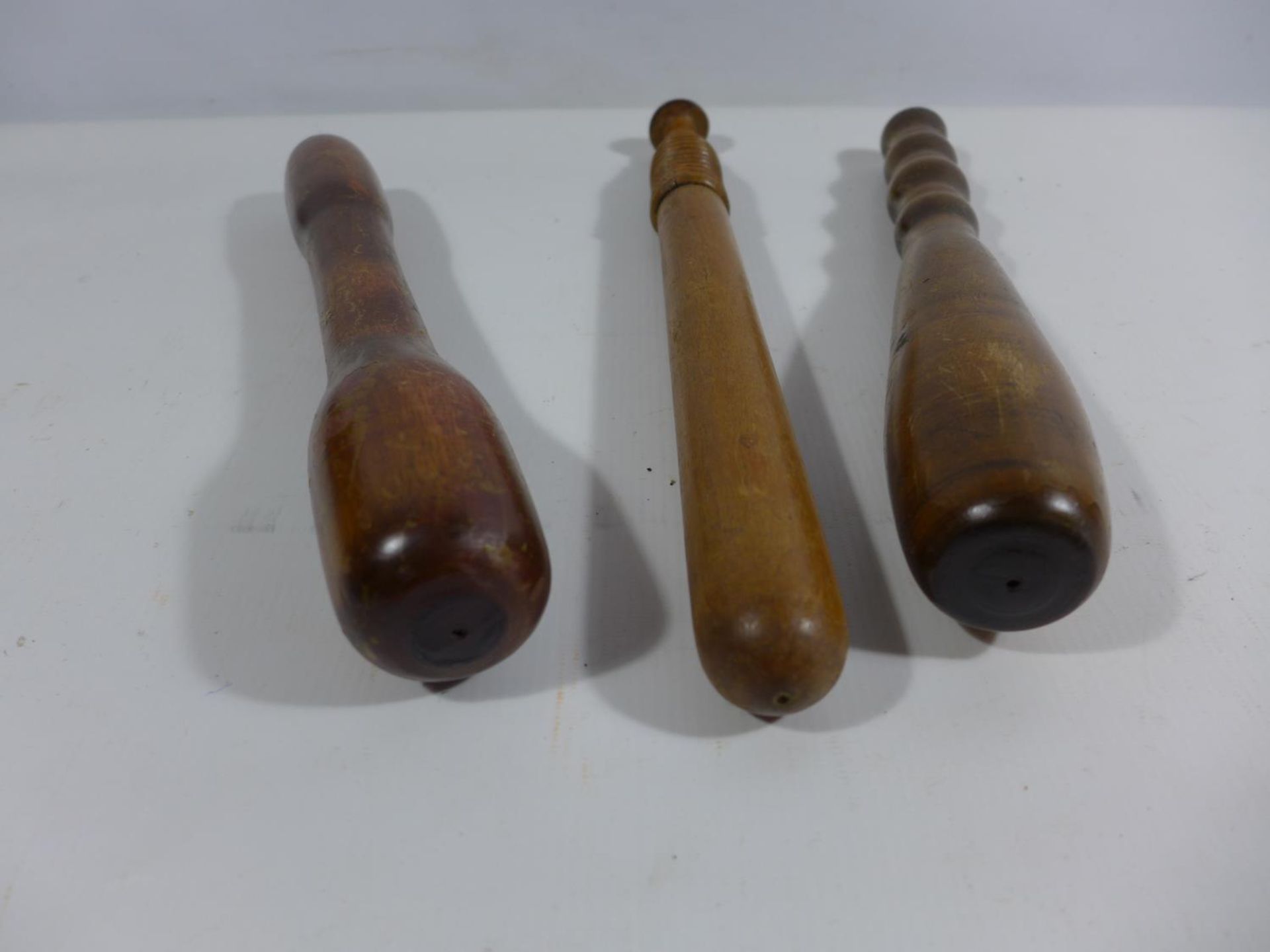 THREE ASSORTED WOODEN CLUBS, LENGTHS 29CM AD 32.5CM - Image 2 of 3