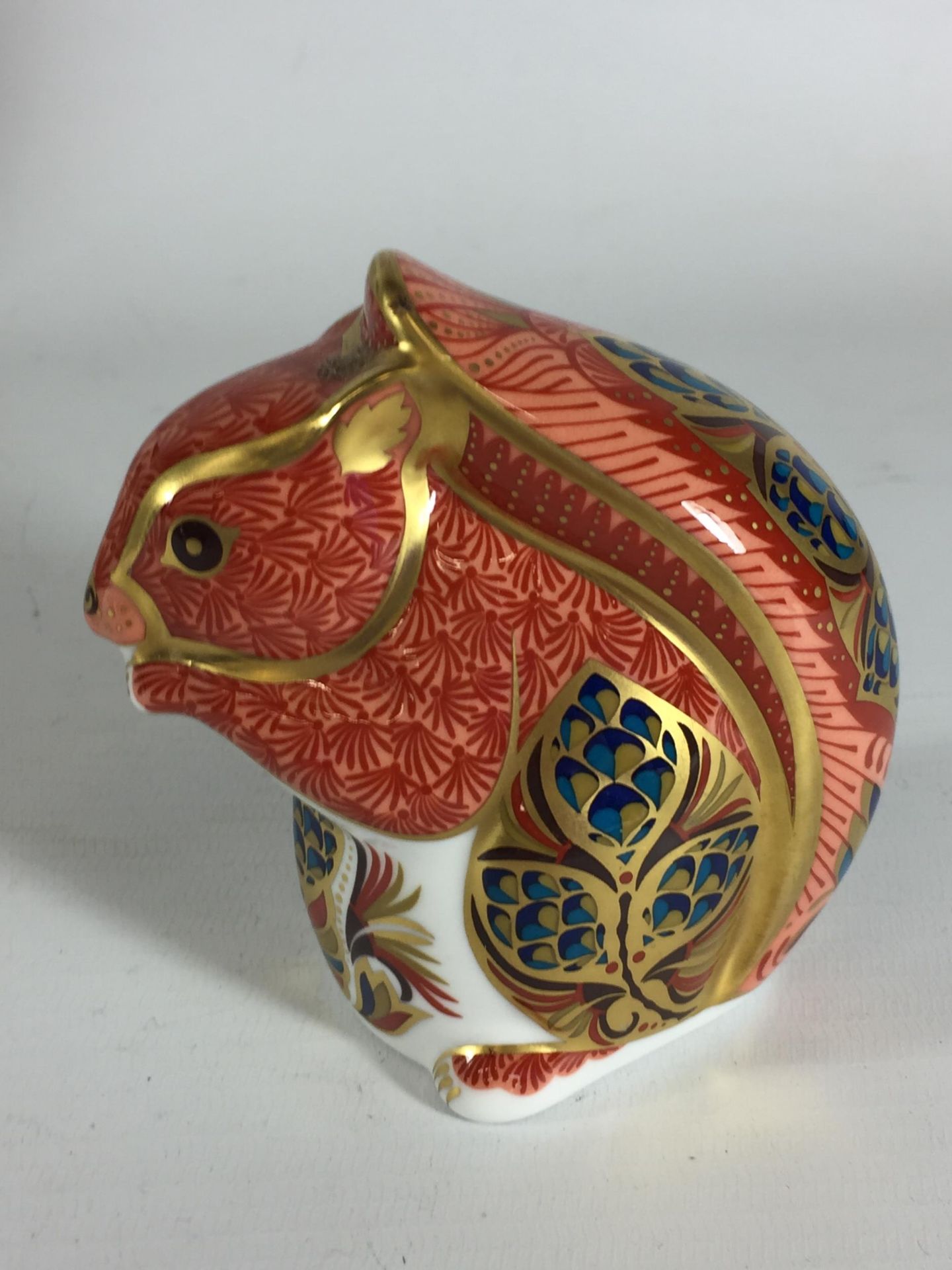 A ROYAL CROWN DERBY SQUIRREL PAPERWEIGHT, GOLD STOPPER