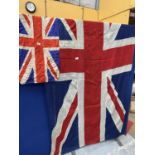 A LARGE HESSIAN UNION JACK, 150 X 267CM AND A SMALLER EXAMPLE