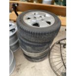 A SET OF FOUYR 'FORD RIMS WITH 185/55R14 TYRES