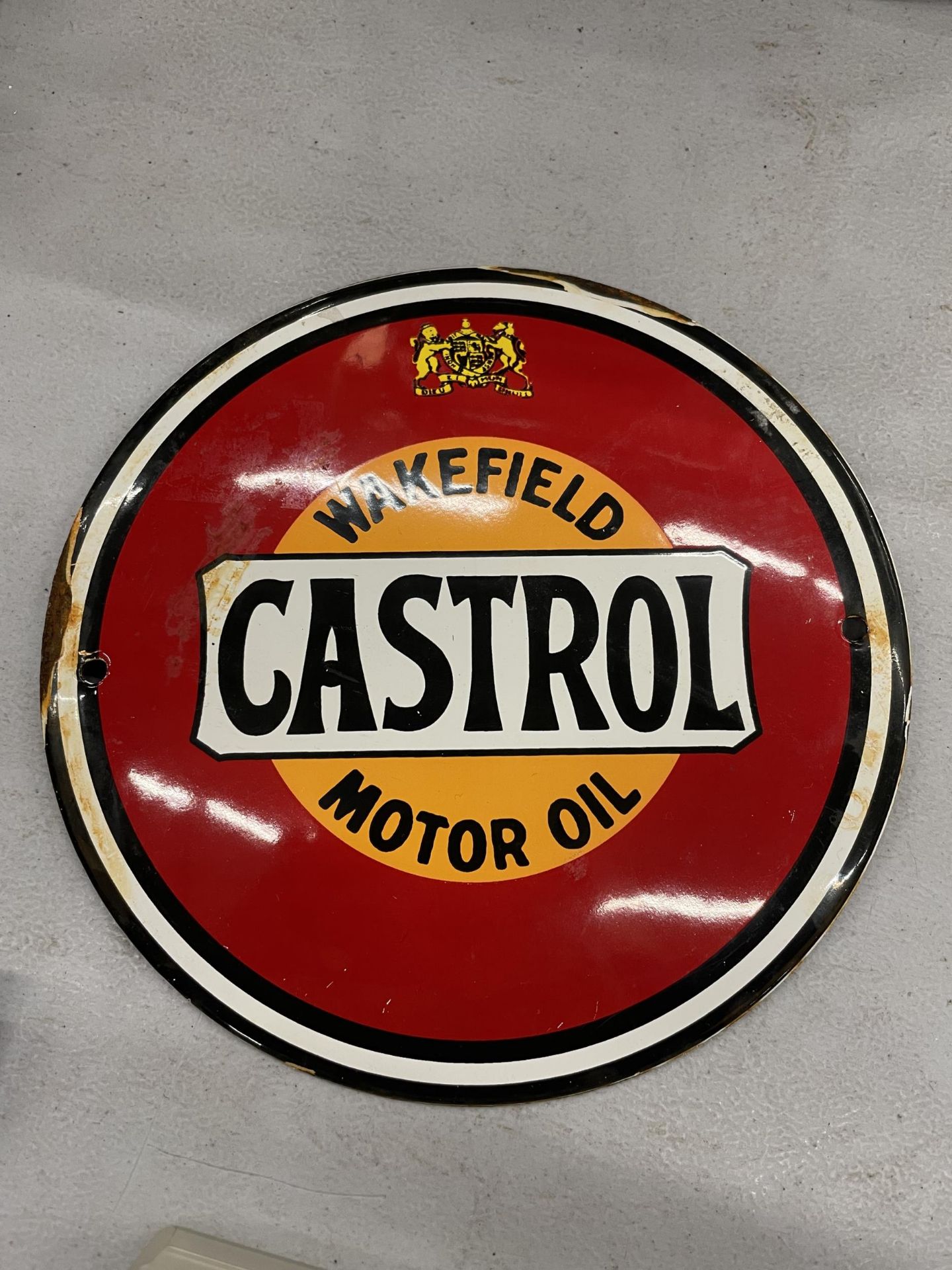 A SMALL ENAMEL SIGN ''WAKEFIELD CASTROL MOTOR OIL' DIAMETER 15CM