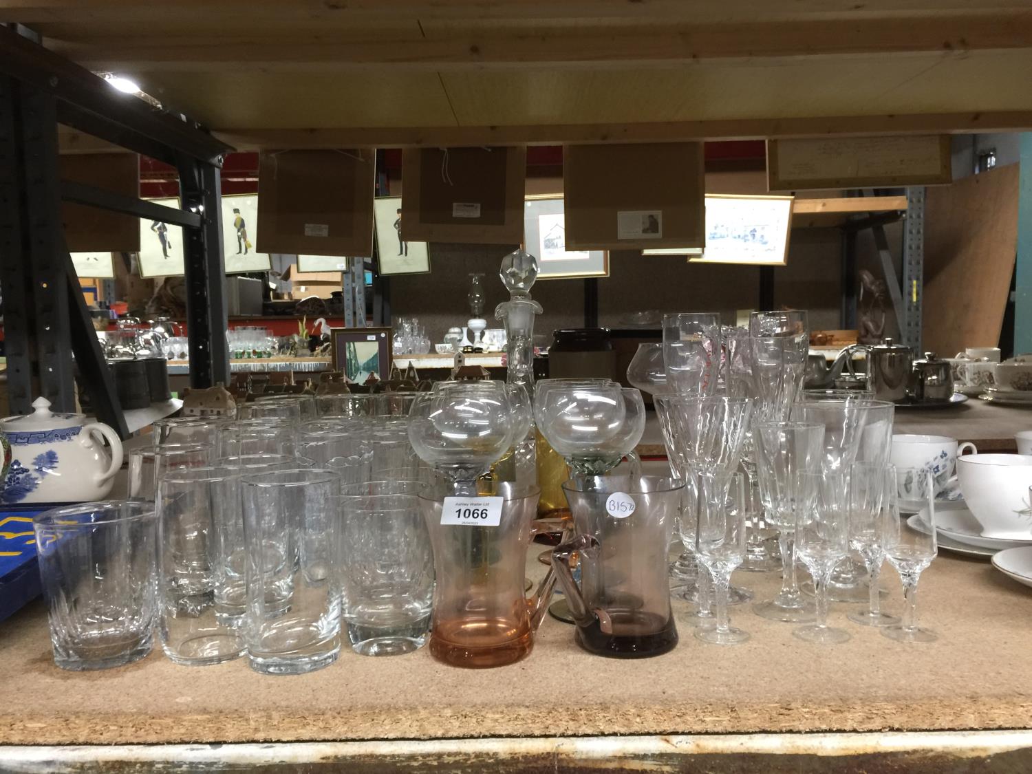 A QUANTITY OF GLASSES TO INCLUDE WINE, A DECANTER, CHAMPAGNE FLUTES, SHERRY, TUMBLERS, ETC