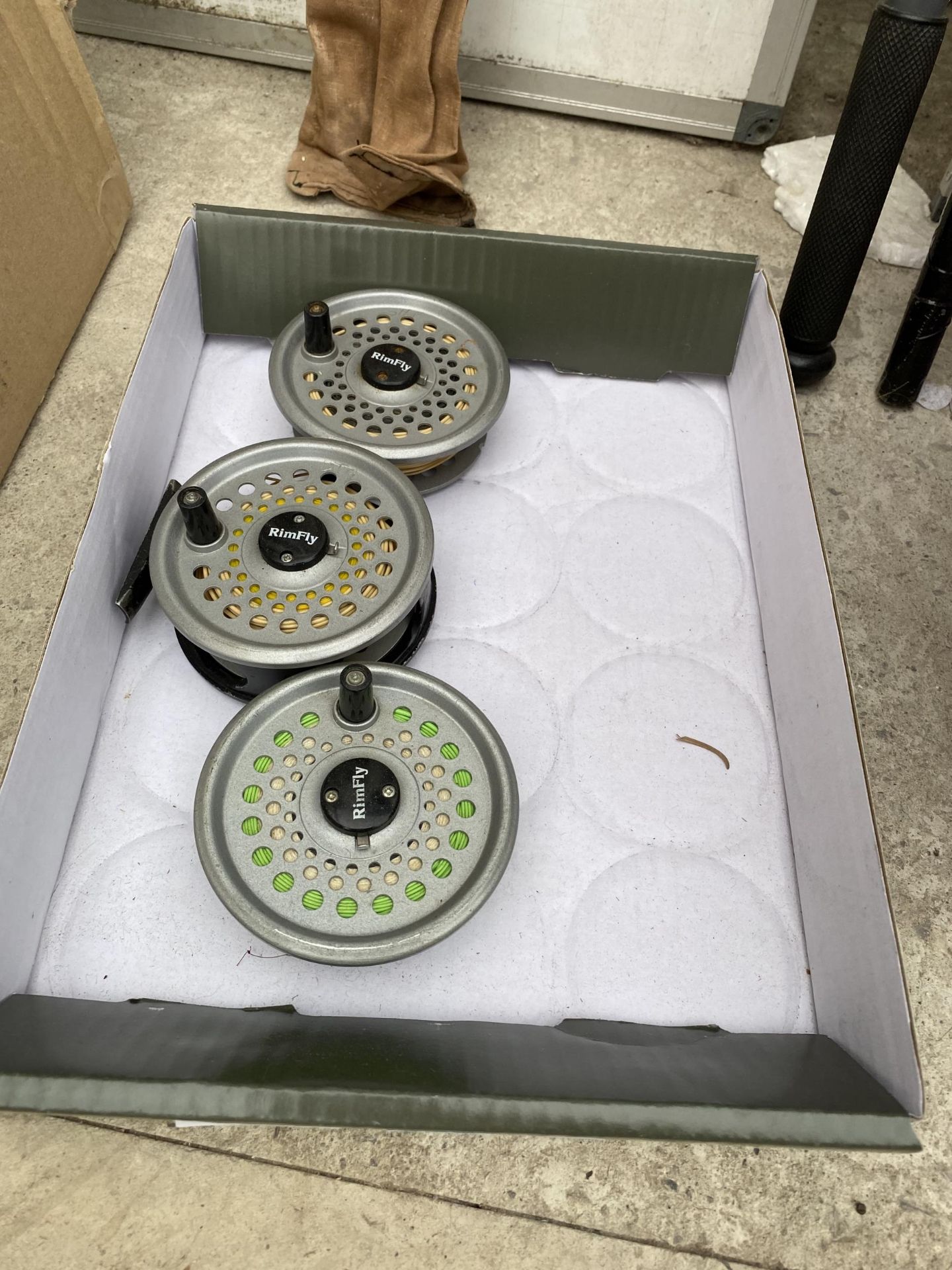 A RIMFLY FISHING REEL AND TWO SPARE SPOOLS