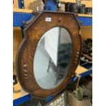 A VINTAGE OAK FRAMED MIRROR