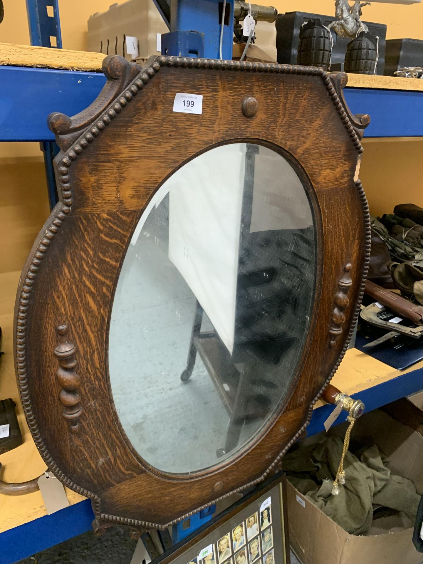 A VINTAGE OAK FRAMED MIRROR