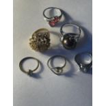 SIX SILVER AND SILVER GILT RINGS