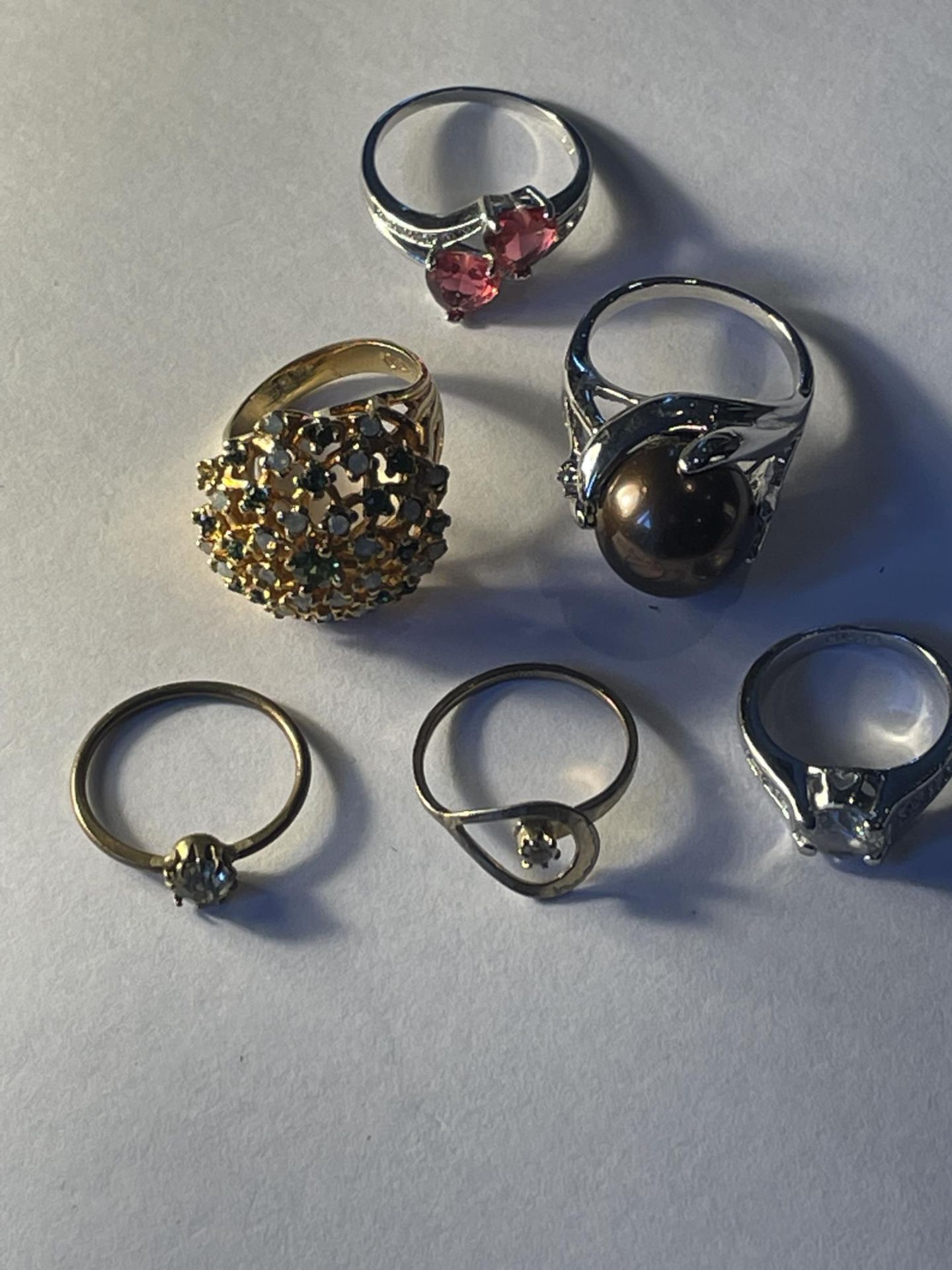 SIX SILVER AND SILVER GILT RINGS