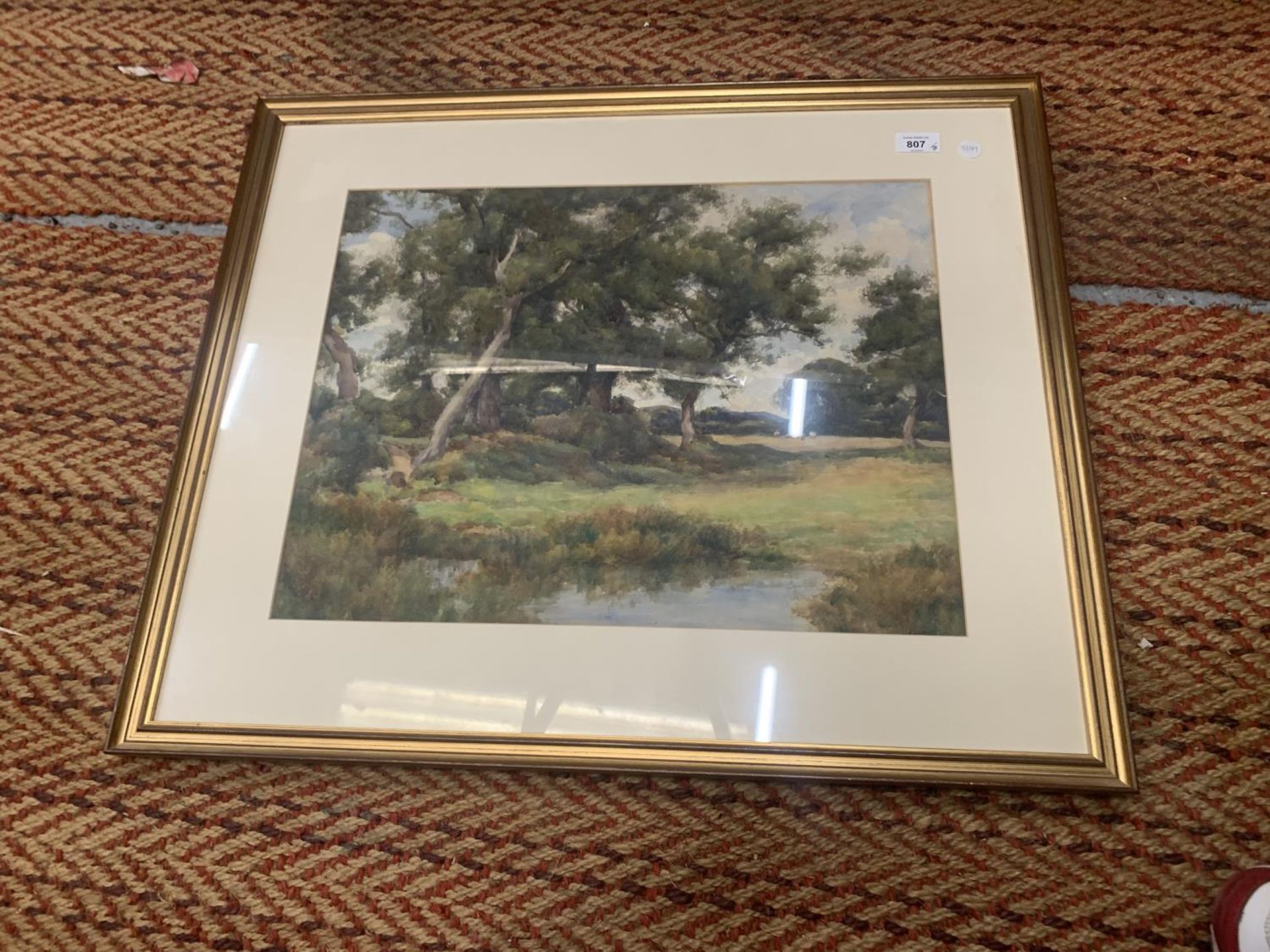 A WATERCOLOUR OF A RURAL SCENE WITH SHEEP 40CM X 52CM, FRAMED AND GLAZED