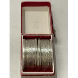 A BOXED PAIR OF HALLMARKED SILVER NAPKIN RINGS, TOTAL WEIGHT 26G