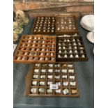 A LARGE QUANTITY OF COLLECTABLE CERAMIC AND CHINA THIMBLES IN FIVE DISPLAY STANDS