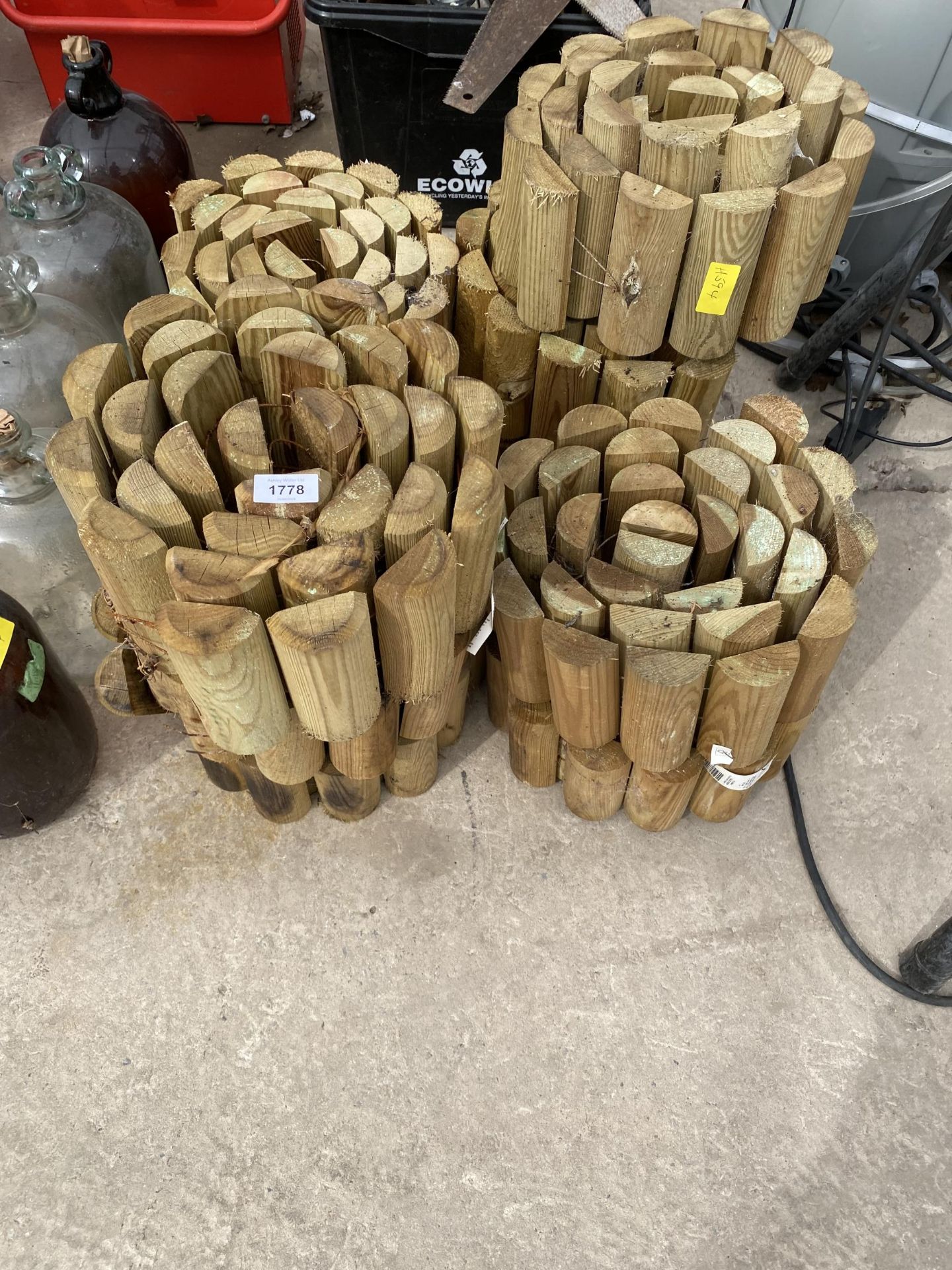 A LARGE QUANTITY OF HALF LOG ROLL EDGING