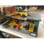 A PLANT HIRE GARAGE WITH TWELVE VARIOUS VEHICLES AND MACHINES