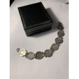 A SILVER JOEY THREE PENCE PIECE BRACELET WITH A PRESENTATION BOX