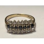 A 9 CARAT GOLD RING WITH TEN SAPPHIRES AND TWELVE CUBIC ZIRCONIAS SIZE K/L