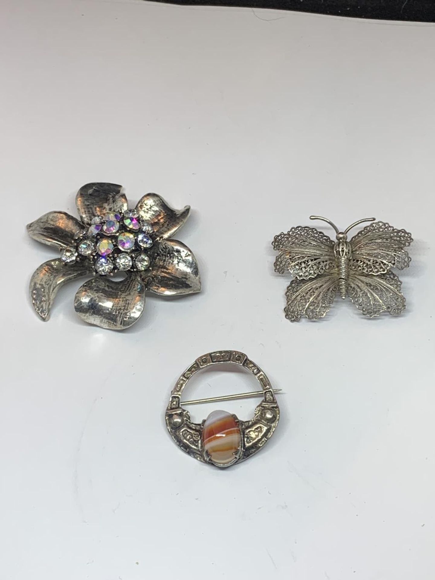 THREE SILVER BROOCHES