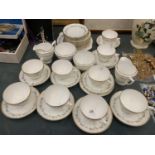 A MINTON 'CHAMPAGNE' TEASET TO INCLUDE A CAKE PLATE, CUPS, SAUCERS, SIDE PLATES, TWO CREAM JUGS