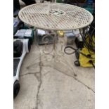 A DECORATIVE METAL BISTRO TABLE