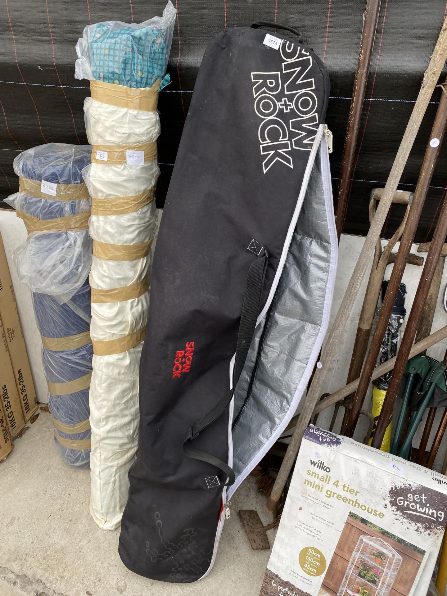 A SET OF SKIS AND SKI POLES COMPLETE WITH A CARRY CASE