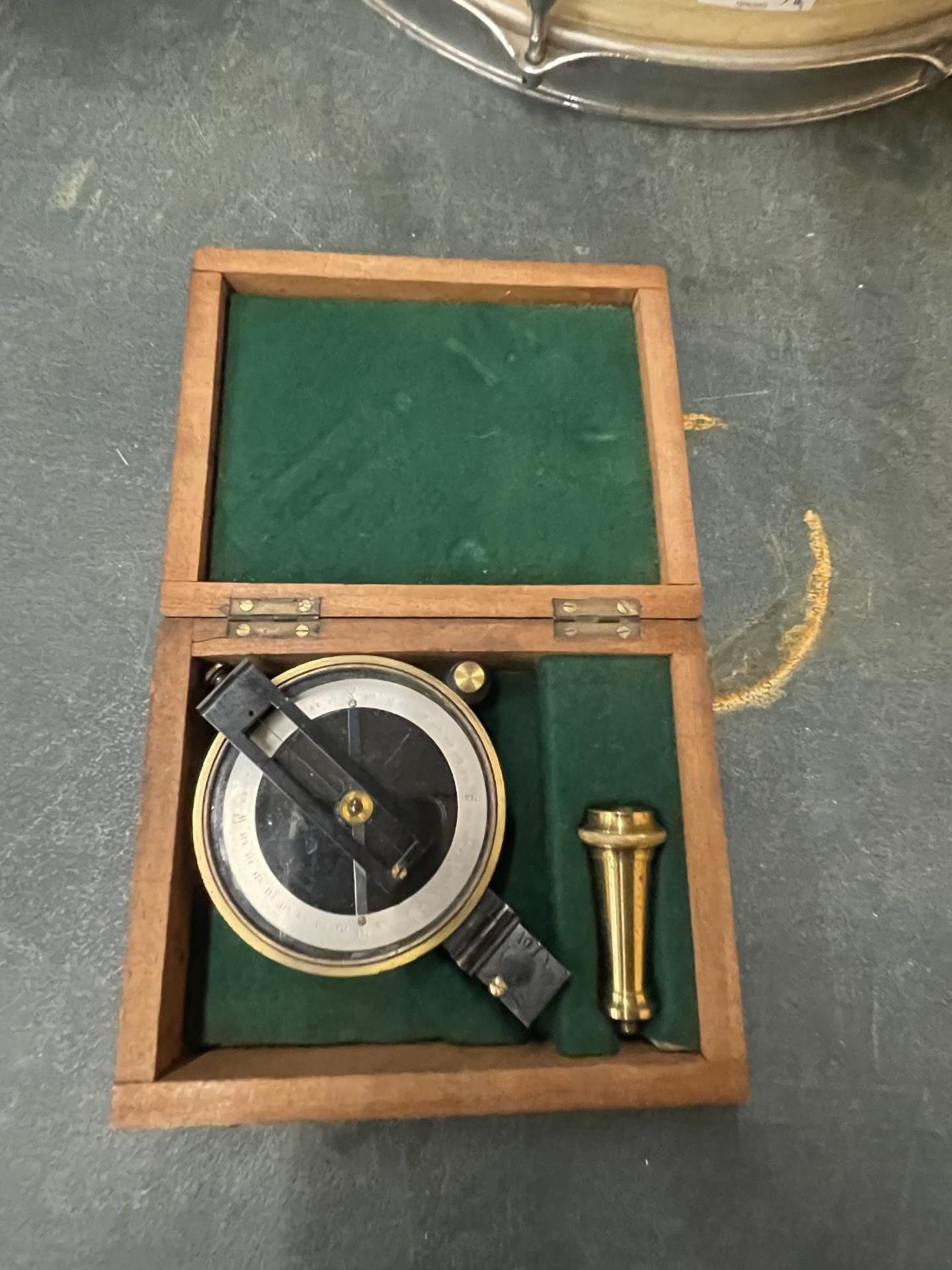 A BOXED SURVEYING COMPASS WITH SCREW ON STAND