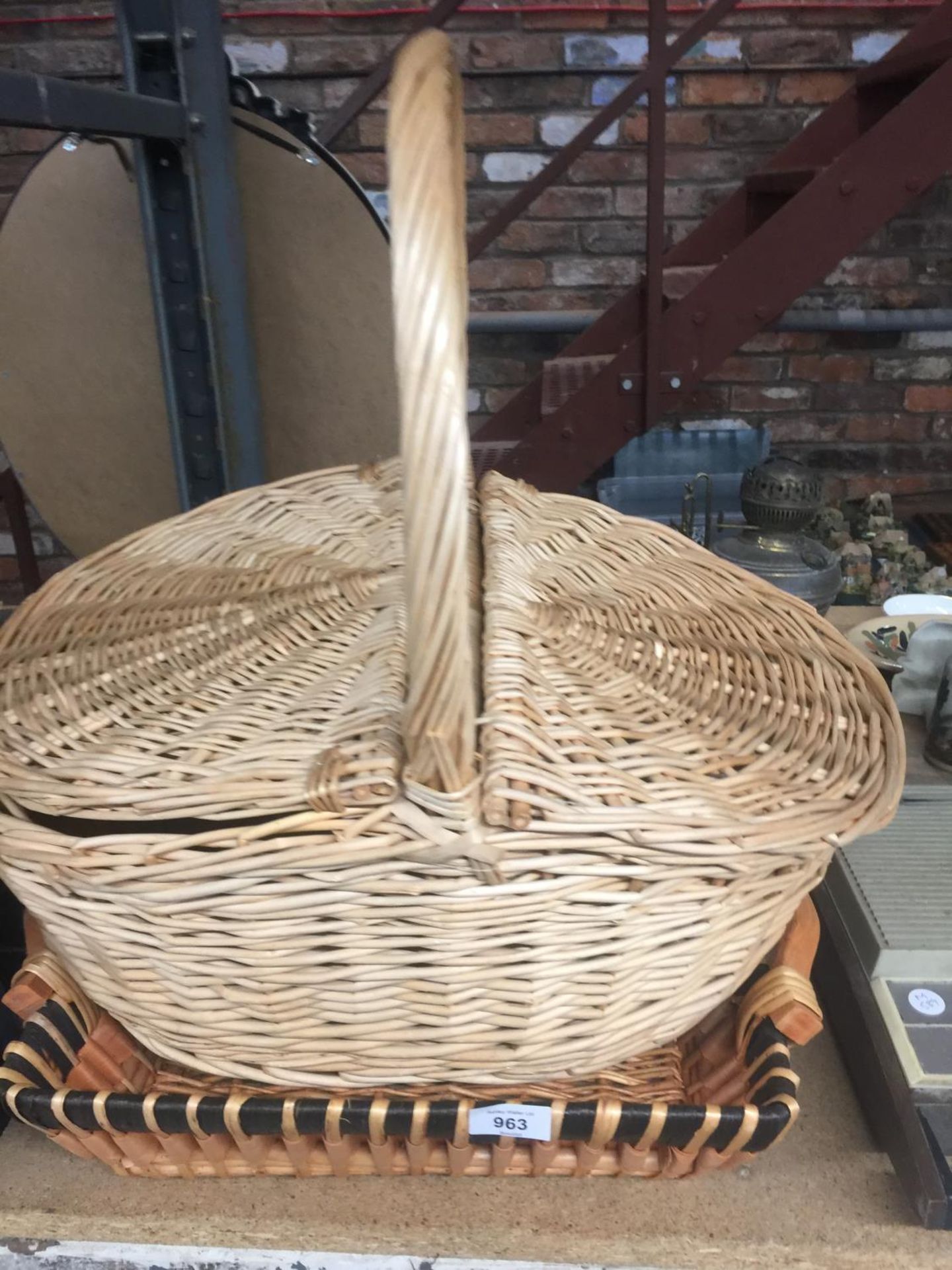 TWO WICKER BASKETS, ONE WITH A LID