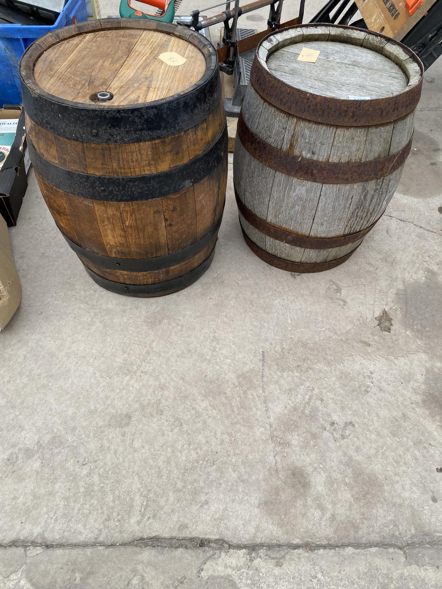 TWO MINIATURE WOODEN AND METAL BANDED SHERRY CASKS