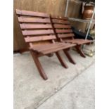 A PAIR OF WOODEN SLATTED FOLDING BEACH HUT CHAIRS