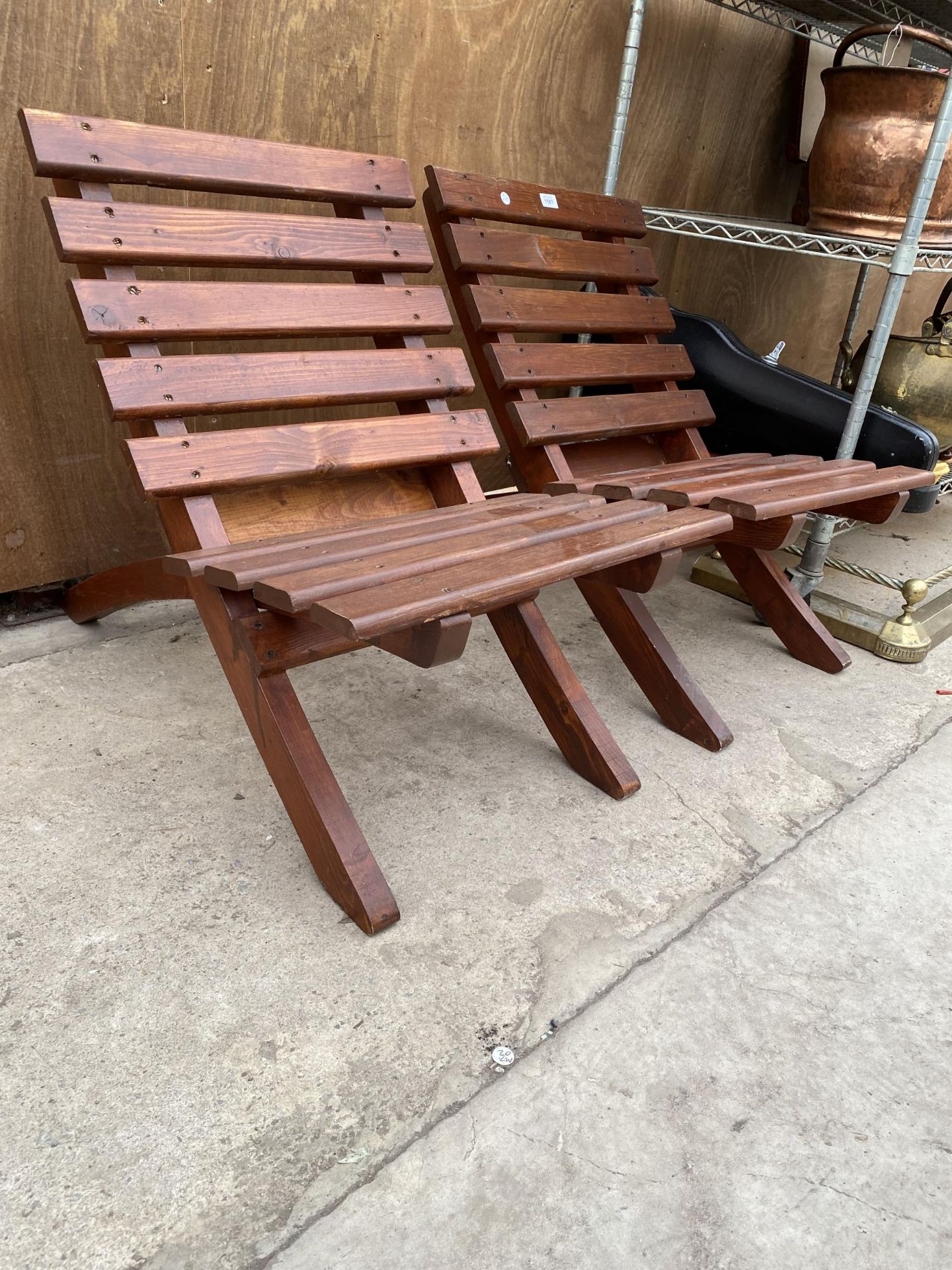 A PAIR OF WOODEN SLATTED FOLDING BEACH HUT CHAIRS